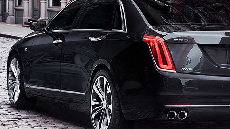rear view angle of a black Cadillac CT6 parked on the street