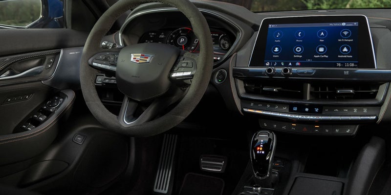 Interior design of a steering wheel and center console from a Cadillac CT5