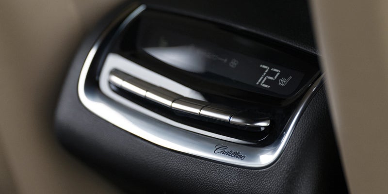 Interior design of a Cadillac XT6 and close up view of its amenities