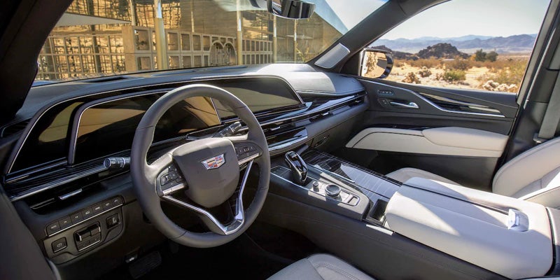 Interior design of a steering wheel and center console of a brand new Cadillac Escalade